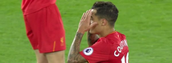 Coutinho sees a shot tipped wide by David De Gea