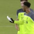 Sturridge and Lallana reading tactical notes on the pitch