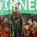 Liverpool boss Jurgen Klopp lifts the 2024 League Cup Trophy
