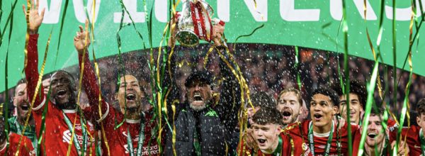 Liverpool boss Jurgen Klopp lifts the 2024 League Cup Trophy