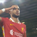 Cody Gakpo salutes the Kop after scoring his opening goal