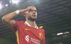 Cody Gakpo salutes the Kop after scoring his opening goal