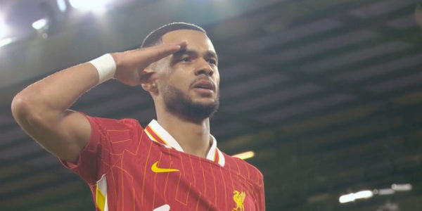 Cody Gakpo salutes the Kop after scoring his opening goal